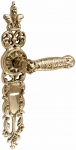 Brass door handles on the plank UNO BAROCCO GRANDE 750 SAFE KEY