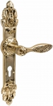 Brass door handles on the plank UNO BAROCCO BELLE 840 PZ